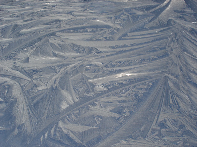 Ice on roof of car. . .